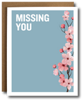 Card with cherry blossoms and 'MISSING YOU' text on a blue background
