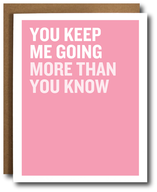 A pink greeting card with bold white text reading 'YOU KEEP ME GOING MORE THAN YOU KNOW' and a brown envelope behind it on a white background.