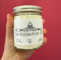 Limited edition hand-poured soy candle featuring a minimalist hand-drawn Washington DC skyline on the label. Scented with cherry blossom fragrance, the 8 oz candle offers a 50+ hour burn time. Held in a clear glass jar with metal lid, made in small batches in Virginia using natural soy wax and cotton wicks.