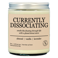 Candle jar labeled 'Currently Dissociating' with description on a white background