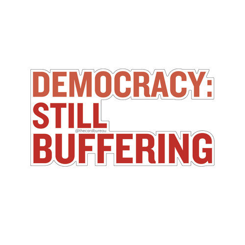 A die cut sticker with the text 'DEMOCRACY: STILL BUFFERING' in large red letters.
