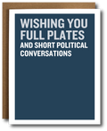 A greeting card with a dark blue front and bold white text reading 'WISHING YOU FULL PLATES AND SHORT POLITICAL CONVERSATIONS,' shown with a brown kraft envelope behind it on a white background.