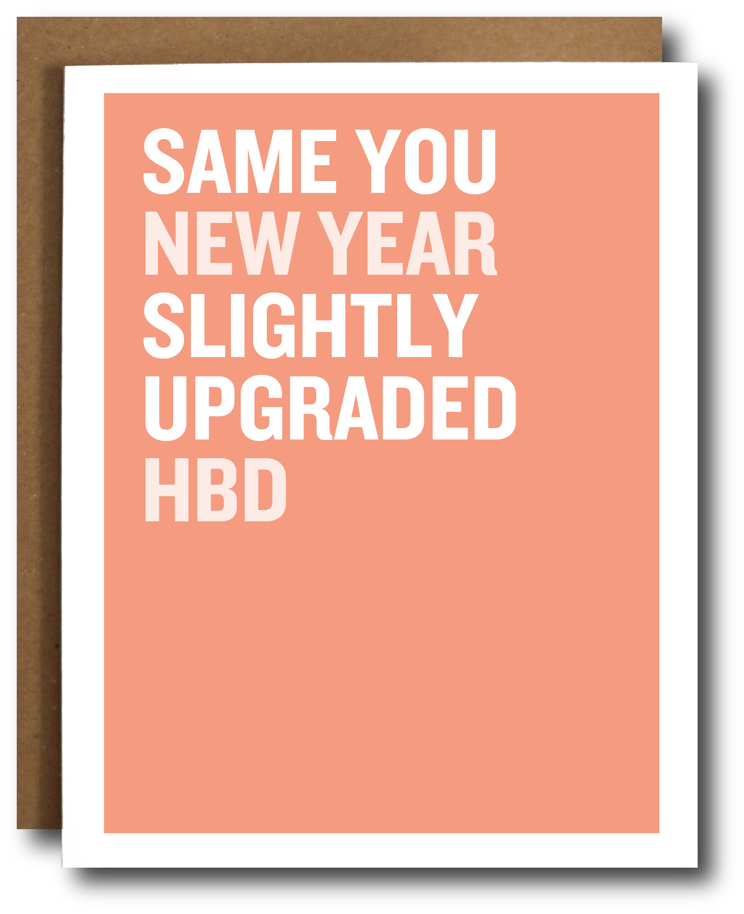 Greeting card with text 'SAME YOU NEW YEAR SLIGHTLY UPGRADED HBD' on a peach background with a brown envelope.