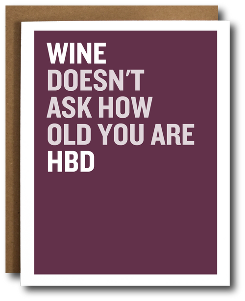 Greeting card with 'Wine doesn't ask how old you are HBD' text on a plum background