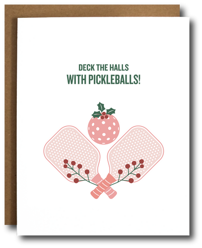 A holiday greeting card with a depiction of pickleball paddles and a stylized Christmas tree, with the text 'DECK THE HALLS WITH PICKLEBALLS!' on the front.