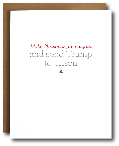 Funny political Christmas card with the phrase 'Make Christmas great again and send Trump to prison' in red and gray text, featuring a small green Christmas tree icon. Minimalist design with white background and kraft paper envelope partially visible. Satirical holiday greeting for progressive audiences.