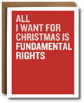 A greeting card with a bold red background and large white text reading 'ALL I WANT FOR CHRISTMAS IS FUNDAMENTAL RIGHTS,' shown with a brown kraft envelope behind it on a white background.