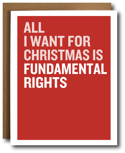 A greeting card with a bold red background and large white text reading 'ALL I WANT FOR CHRISTMAS IS FUNDAMENTAL RIGHTS,' shown with a brown kraft envelope behind it on a white background.