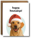Greeting card featuring a smiling golden labrador wearing a red and white Santa hat with the text “Happy Howlidays!”