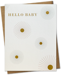 A greeting card with 'Hello Baby' text and a starburst design in gold foil on the front, with a beige envelope.