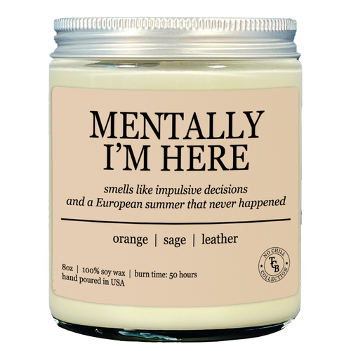 Candle that says "mentally im here" on the front