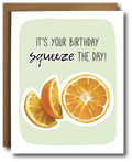 Birthday card with orange slices and text 'It's your birthday, squeeze the day!' on a light green background.