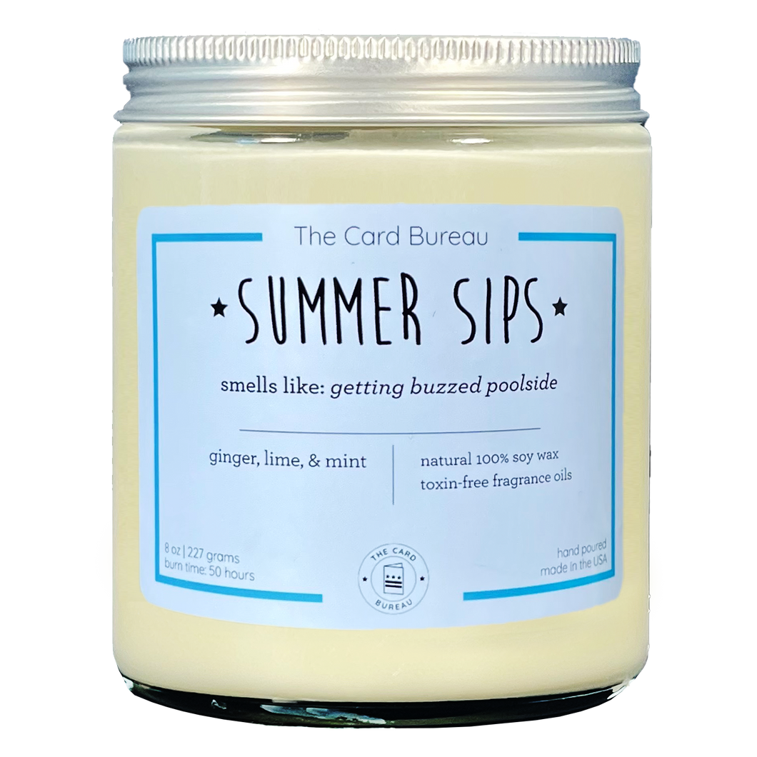 Summer Sips 8 ounce 50 hour soy wax candle in glass jar with lid. Tagline is smells like getting buzzed poolside., scent is ginger lime and mint.