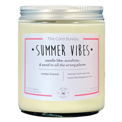 Photo of Summer Vibes 8ounce 50 hour soy wax candle in glass jar with tin lid. Tagline reads Smells like sunshine... and sand in all the wrong places. scent is ocean breeze